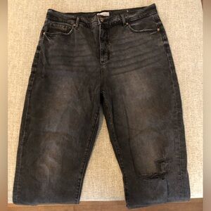 Faded, black denim ripped jeans originally from Loft. Style is The Straight Crop